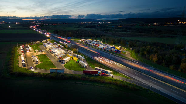 istock Highway and rest area at dusk - aerial view 1451823827