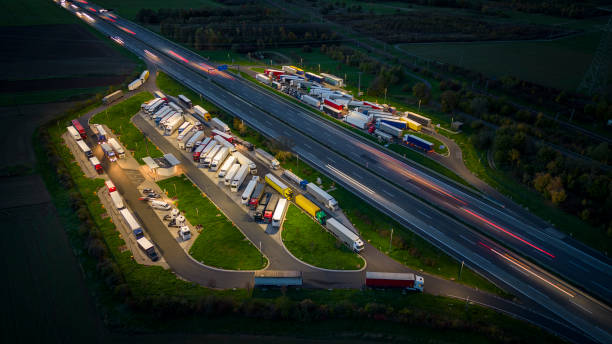 istock Highway and rest area at dusk - aerial view 1451823869