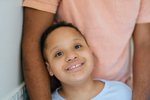 Boy with down syndrome looking at camera