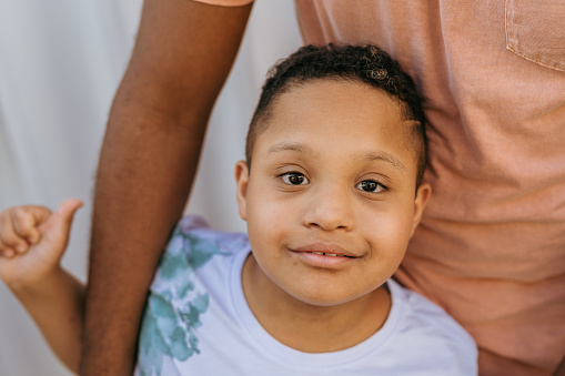 Boy with down syndrome looking at camera