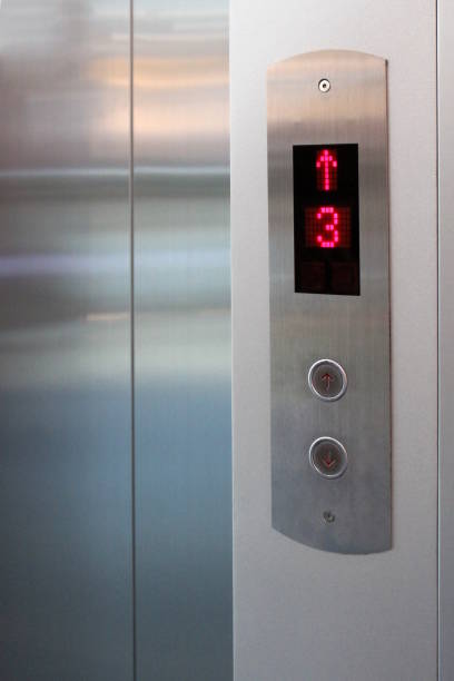istock The elevator button and number screen show the floor and direction. 1451824303