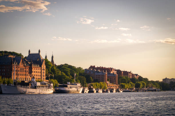 istock View of buildings by river against sky 1451826657