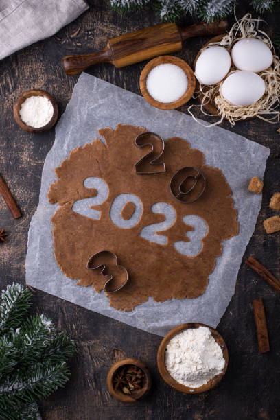 istock Gingerbread dough for cookies in shape of 2023 1451827114