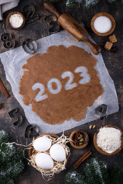 istock Gingerbread dough for cookies in shape of 2023 1451827142