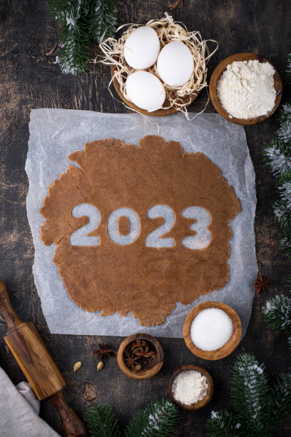 istock Gingerbread dough for cookies in shape of 2023 1451827201
