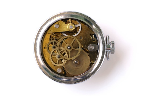 pocket watch gears on white background
