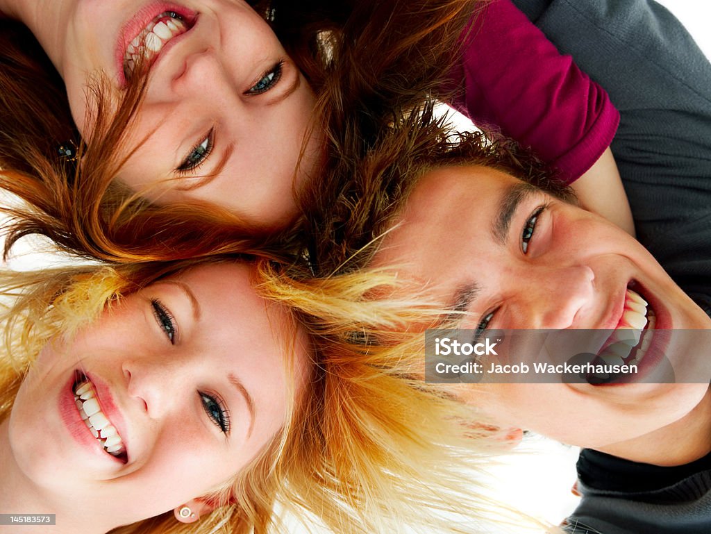 Close-up of three friends smiling Close-up of three friends smiling. Close-up Stock Photo