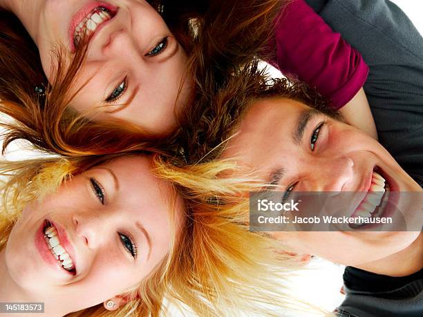 Closeup Of Three Friends Smiling Stock Photo - Download Image Now - Close-up, Portrait, Studio Shot