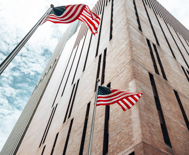 istock us flag waving on the city 1451837491