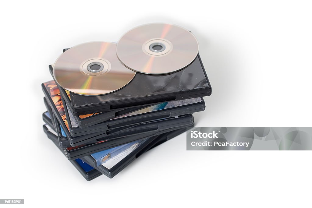 DVD Pile A pile of DVD cases with DVDs on top DVD Stock Photo