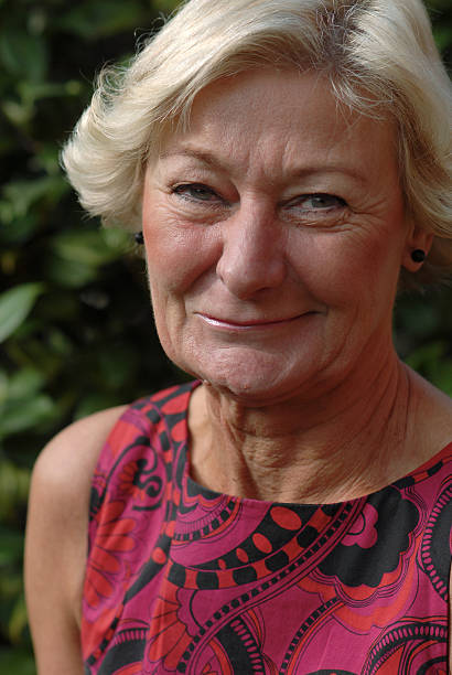 istock older blond woman smiling 145184141