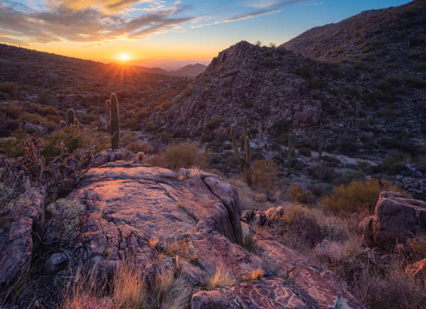 istock Sunset illuminates rugged desert mountain with petroglyphs inscribed on the rocks below 1451842775