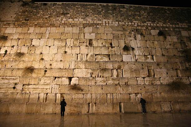 istock two Jews are praying in the Western Wall . 145184529