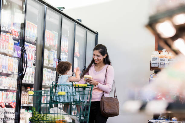 istock While shopping, mom and baby smile and laugh 1451848627