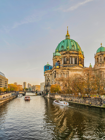 Vertical shot of Berlin Cathedral on Spree river during sunset, Germany