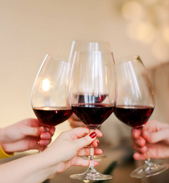 istock Crop friends clinking glasses of wine 1451852277