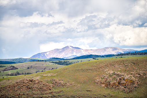 Gunnison county barren high desert canyon landscape with mount Crested Butte in distance with snow in Colorado in summer