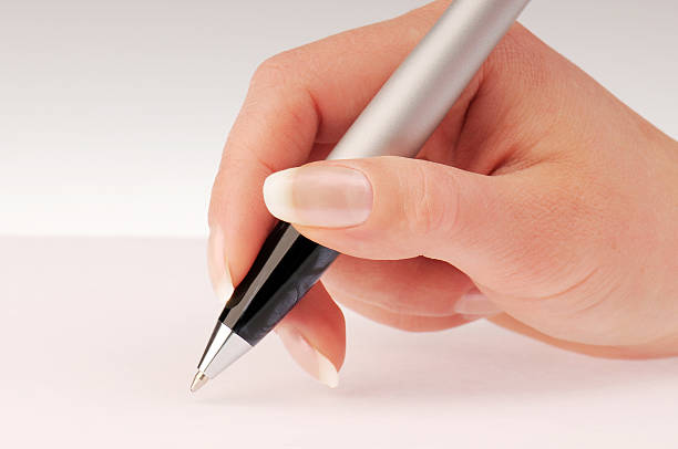 Hand and pen stock photo