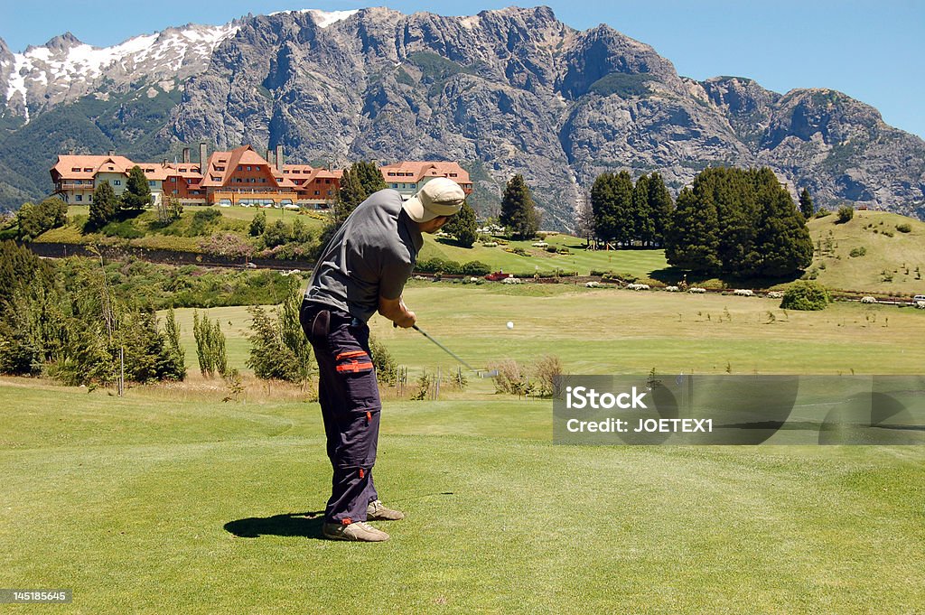 golf in the mountains man playing golf in a court in the mountains Argentina Stock Photo