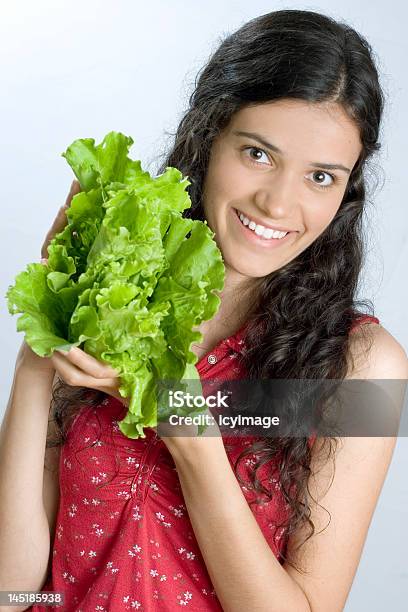 Girl Holding Lettuce Stock Photo - Download Image Now - Adult, Body Care, Candid