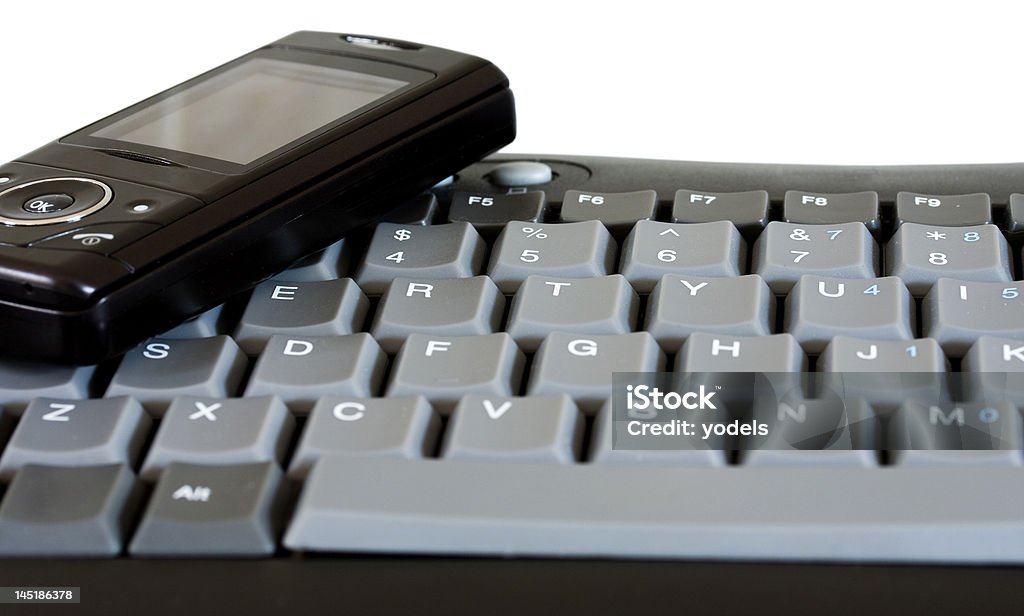 Celular e teclado - Foto de stock de Apoio royalty-free