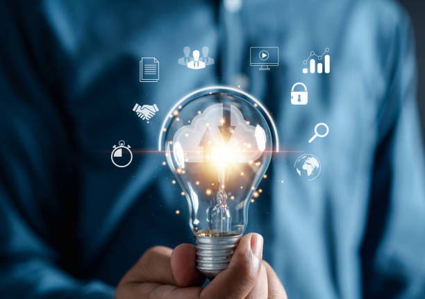 istock Businessman holding Light bulb global internet connection. planning development leadership and customer target with Business technology and digital marketing, Financial and banking, Digital link tech. 1451864672