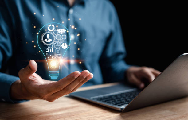 istock Man hand holding lightbulb which for mind, creative, idea, innovation, motivation planning development leadership and customer target group concept. 1451864712