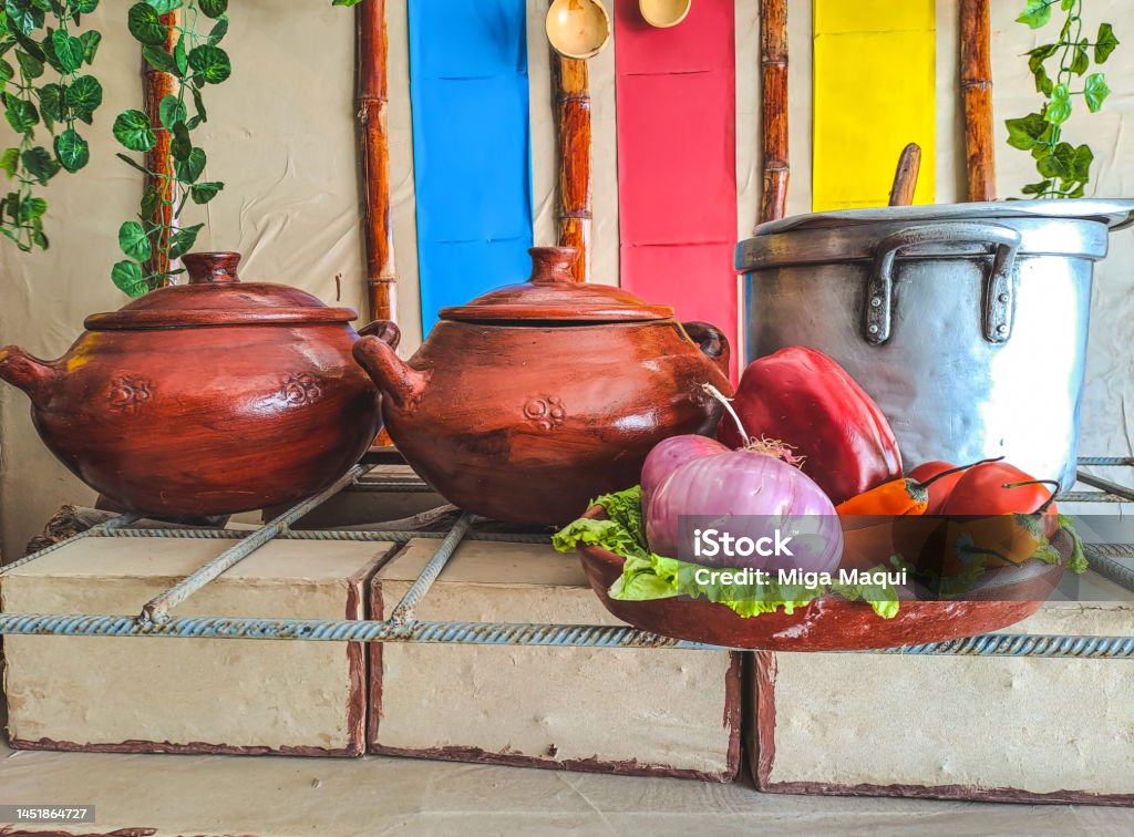 Clay pots displayed in a traditional peruvian restaurant in Piura. clay pots in a Peruvian restaurant, in Piura. Clay pots displayed in a traditional peruvian restaurant in Piura. ollas de barro en un restaurante peruano, en Piura. Cooking Stock Photo
