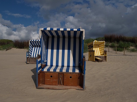 folding chairs on sandy beach