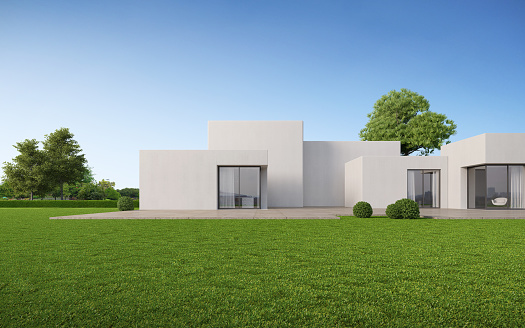 Modern exterior of white boxes house with lawn and blue sky.3d rendering