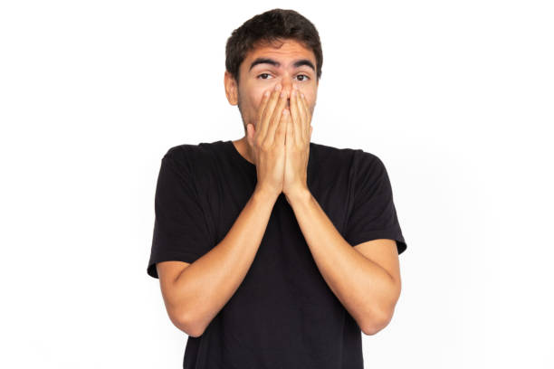 istock Shocked young man covering face 1451866067