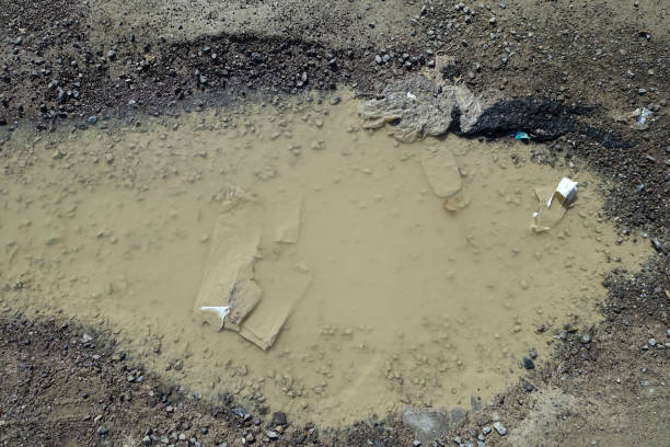 istock rough road, muddy deformed road, rain-destroyed roads, 1451871558