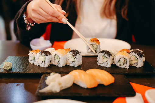 Sushi box on a wooden background. Japan restaurant menu. Sushi  Top view. Copyspace