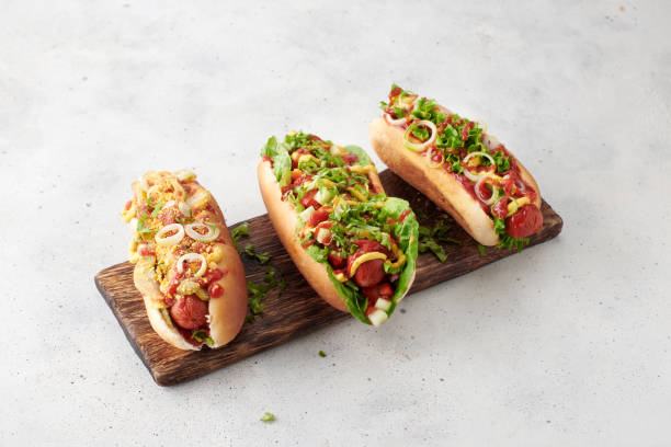 Fresh made hot dogs with ketchup, mustard and salad stock photo