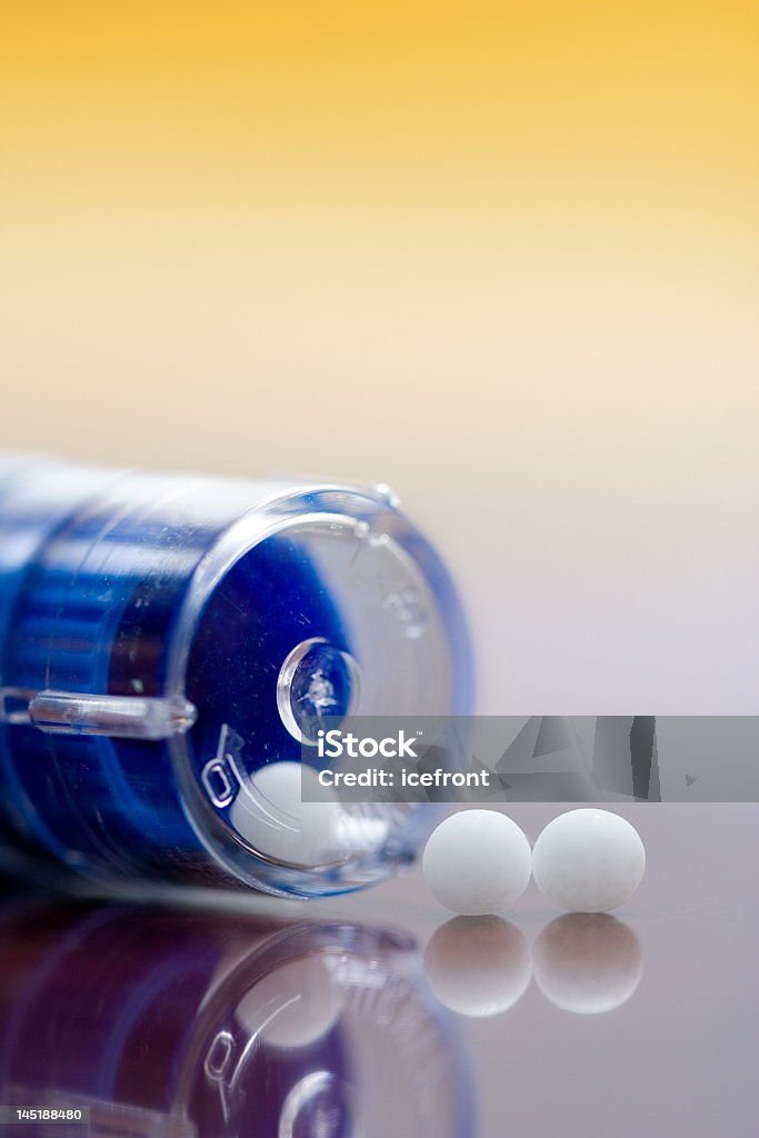 Homeopathic medication Extreme macro of homeopathic medications - container and small white balls Alternative Medicine Stock Photo