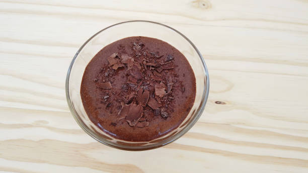 istock Homemade chocolate mousse on a glass. Top view 1451885780