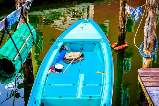 typical small fishing boat in italy - rowboat nautical vessel small motorboat imagens e fotografias de stock