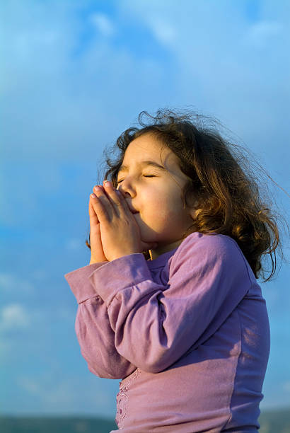 istock little girl making a wish 145188762