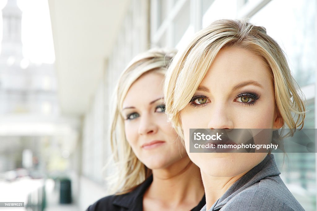 business concept business woman posing in a business setting in front of business buildings Adult Stock Photo