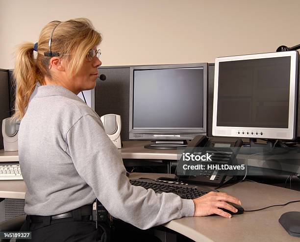 Police Dispatcher Working At Console Stock Photo - Download Image Now - Emergency Services Occupation, Dispatcher, Police Force