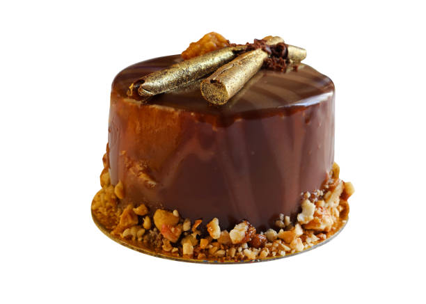 istock Chocolate cake isolate. Chocolate covered cake with golden sticks 1451897278