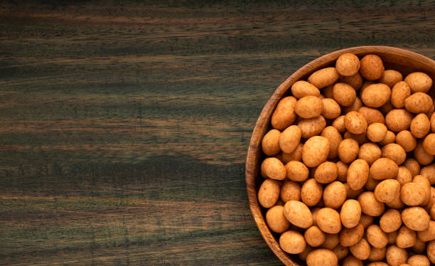 istock Arachis hypogaea - Organic mexican peanuts in the bowl 1451900212