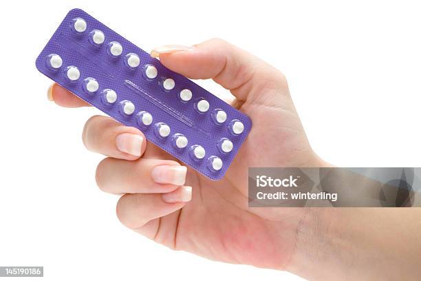 Segurando Pílulas - Fotografias de stock e mais imagens de Contracetivo - Contracetivo, Educação Sexual, Pílula Anticoncepcional