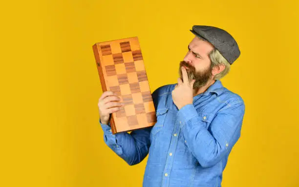 Grandmaster experienced player. Game strategy concept. Chess lesson. Cognitive development. Teacher chess competition. Board game. Bearded man playing chess. Chess figures. Intellectual games.