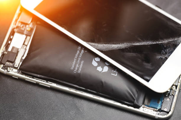 istock Broken modern smartphone due to bloated lithium ion battery 1451904736