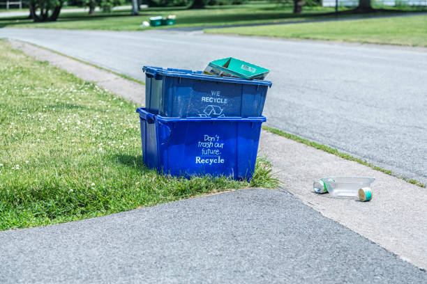 istock Overflowing Recycling Bins Waiting For Garbage Truck Pick Up 1451904813
