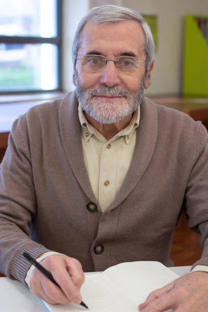 istock Portrait of cheerful senior man preparing for courses 1451905620