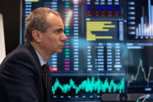istock Side view of stock market trader analyzing charts 1451906678