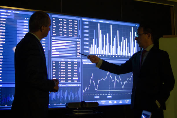 istock Serious businessmen monitoring analytical charts 1451906763