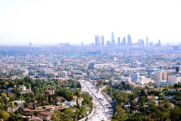 Los Angeles metropolitan area view with downtown on horizon Image overlooks the 101 Freeway, Hollywood, and downtown Los Angeles, California. los angeles aerial stock pictures, royalty-free photos & images